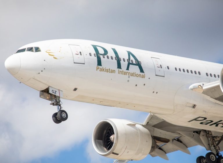 Work Permit: A pia airplane soaring through the sky, prominently displaying the letters "pia," symbolizing travel from Pakistan to Canada.